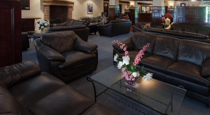 a living room filled with furniture and a couch, Europa Gatwick Hotel in London