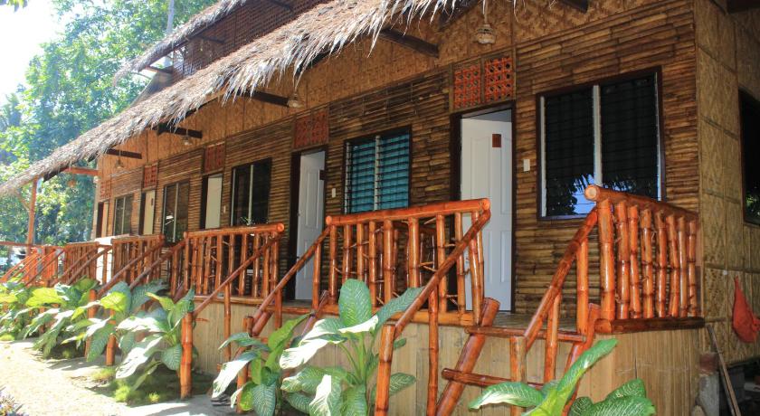 a large wooden house with a balcony, Loboc Riverfront Resort and Restaurant in Bohol