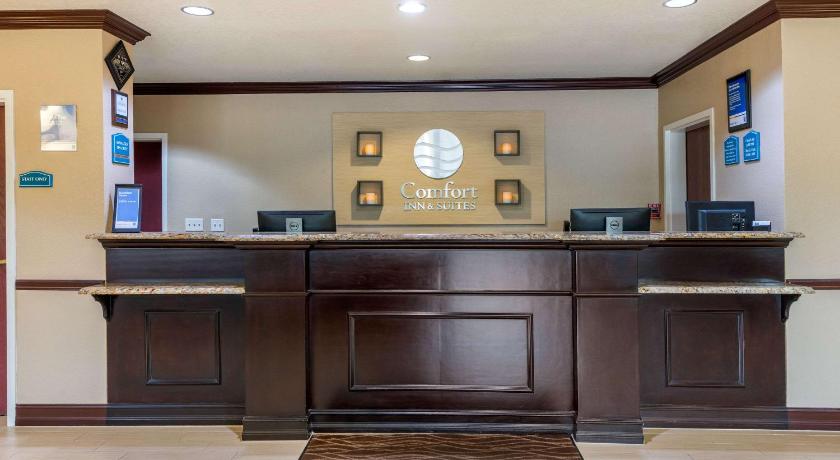 a kitchen with a wooden floor and wooden cabinets, Comfort Inn & Suites Northeast - Gateway in St. Petersburg (FL)
