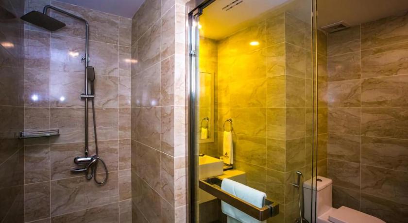 a bathroom with a toilet, shower, and sink, Austin Park Hotel in Johor Bahru