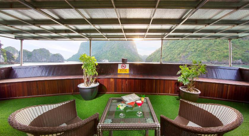 a living room filled with tables and chairs, Signature Halong Cruise in Hạ Long