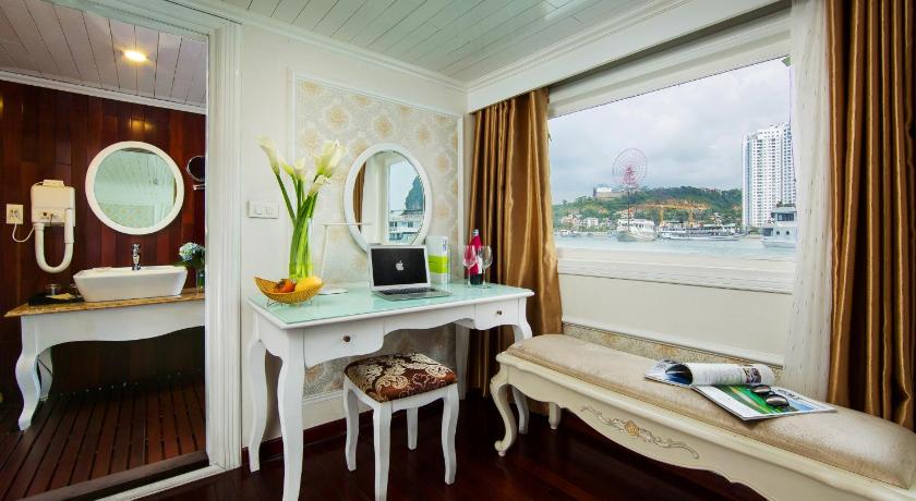 a living room filled with furniture and a window, Signature Royal Cruise in Hạ Long