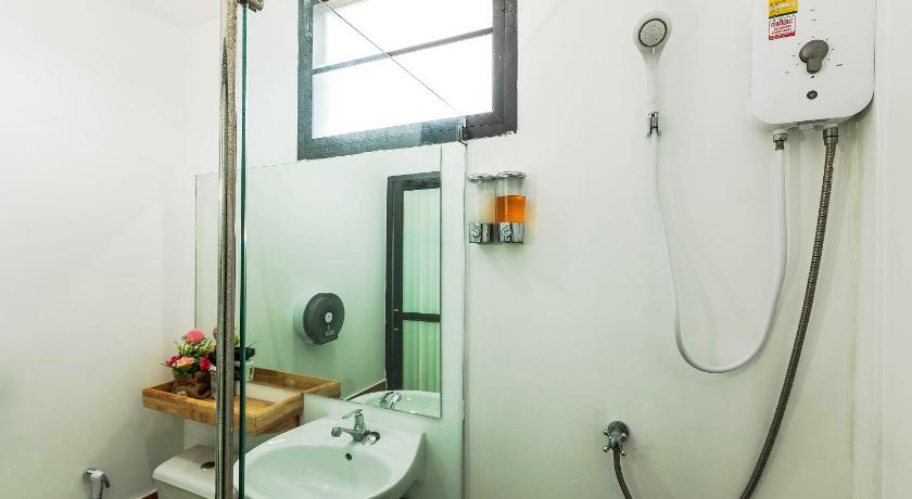 a bathroom with a shower, sink, and toilet, Phi Phi Chang Grand Resort in Ko Phi Phi