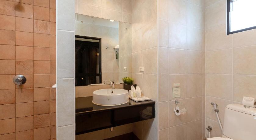 a bathroom with a sink, toilet and bathtub, Baramee Resortel in Phuket