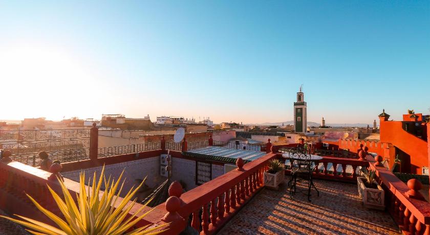 a large building with a clock tower on top of it, Riad Royal in Meknes