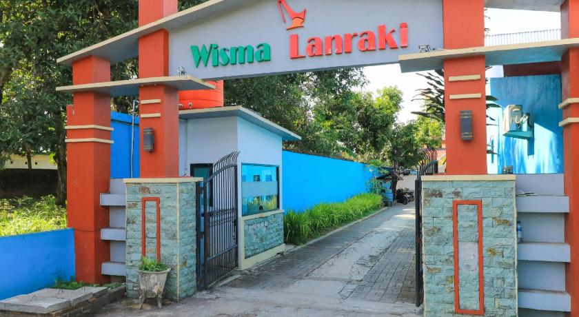 a building with a sign on the side of it, Wisma Lanraki in Makassar