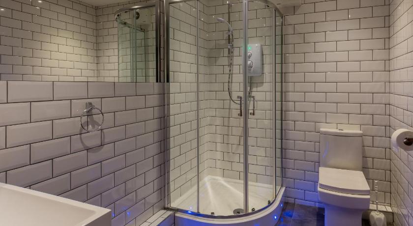 a bathroom with a shower, toilet and tub, CoDE Co-Living - The LoFT - Edinburgh in Edinburgh