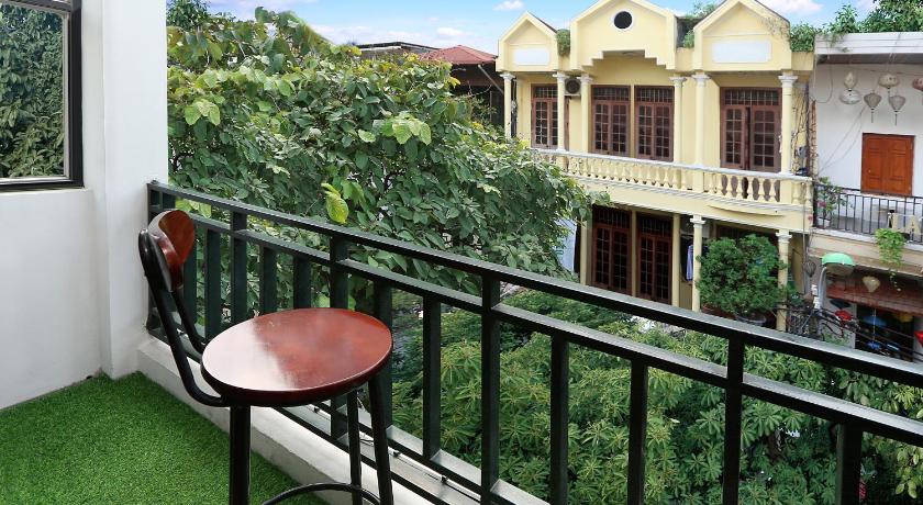 a patio area with a balcony and a balcony view, Hanoi House Hostel & Travel in Hanoi