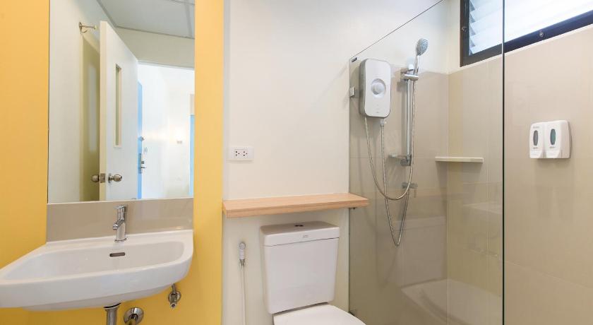 a bathroom with a toilet, sink, and shower, Hop Inn Nakhon Pathom (SHA Extra Plus) in Nakhon Pathom