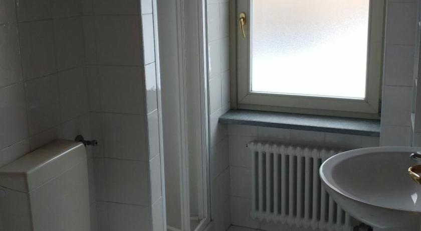 a bathroom with a sink, toilet and bathtub, Casa De Giorgis in Aosta