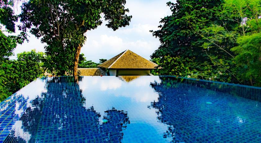 a swimming pool with a blue sky, Pawanthorn Pool Villa Samui (SHA Plus+) in Koh Samui
