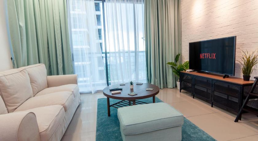 a living room filled with furniture and a tv, Condo near Bukit Jalil by Idealhub in Kuala Lumpur
