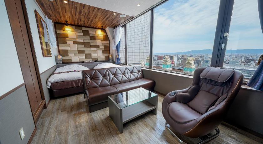 a living room with a couch and a chair, Hotel Bali Tower Tennoji in Osaka