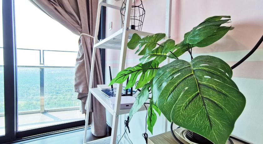 a plant that is growing out of a window, Almas Suites Puteri Harbour Hello Kitty in Johor Bahru