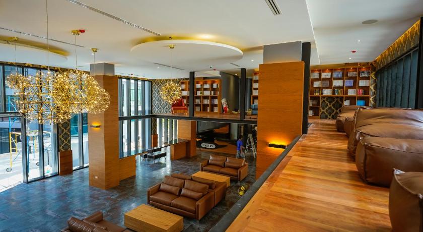 a living room filled with furniture and a large window, Citygate Kamala Resort and Residence in Phuket