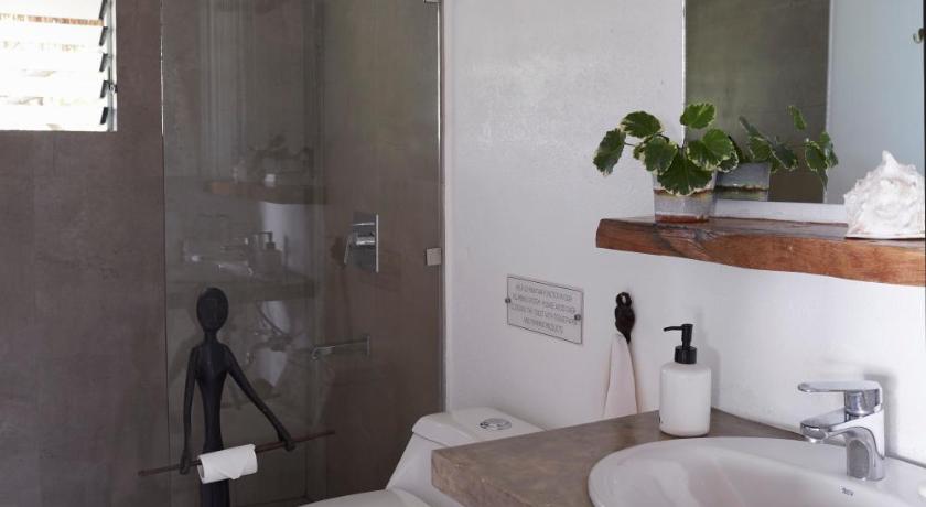 a bathroom with a toilet, sink and tub, Diniview Villas Resort in Boracay Island