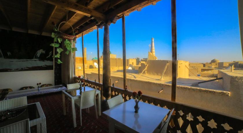 a restaurant with a view of the ocean, Rasulboy Guest House in Khiva