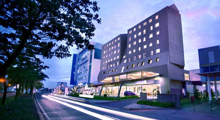 a city street with a large building, Fame Hotel Gading Serpong in Tangerang