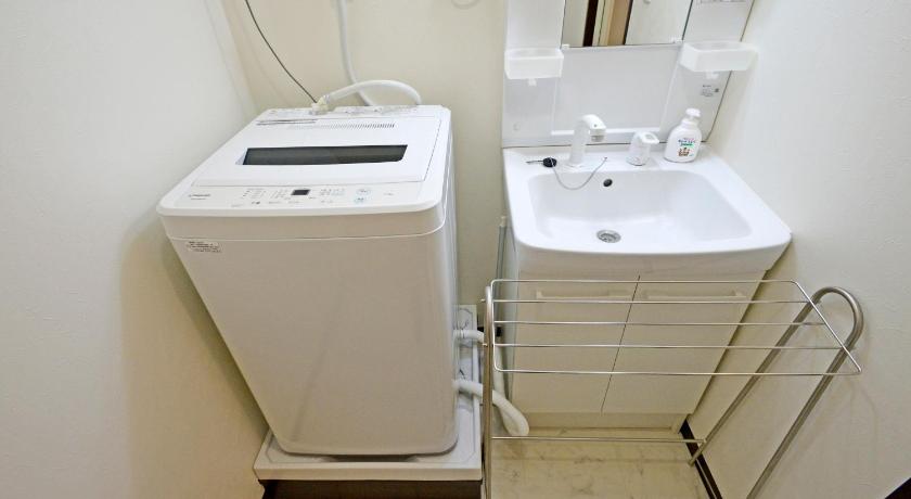 a white sink sitting next to a white toilet, YUZU HOUSE in Tokyo