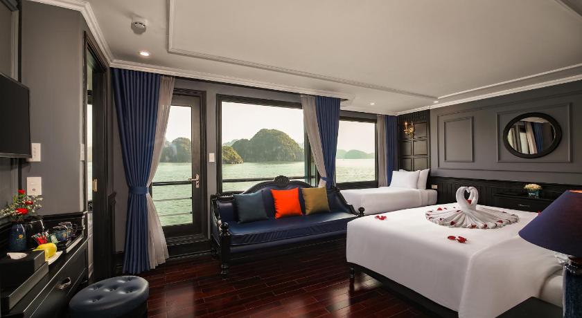 a living room filled with furniture and a large window, Rosy Cruises in Hạ Long