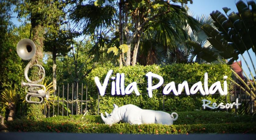 a white horse statue in front of a sign, Villa Panalai in Nakhon Nayok