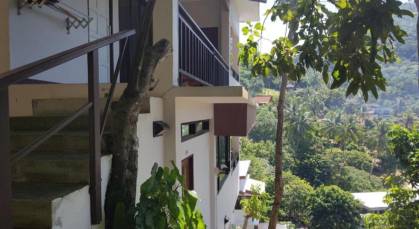 a building with a balcony and a tree, Balcony Villa. in Ko Tao