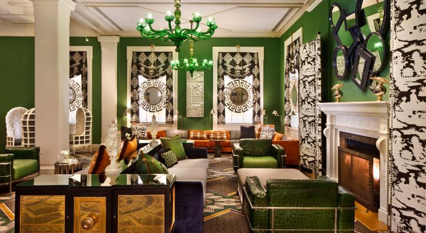 a living room filled with furniture and decor, Kimpton Hotel Monaco Washington DC, an IHG Hotel in Washington D.C.