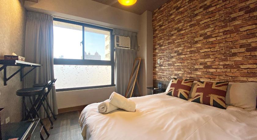 a bedroom with a bed and a window, Dreamcatcher in Taichung