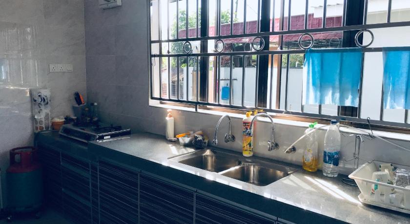 a bathroom with a sink and a window, CoZy and comfortable Homestay in sungai siput in Ipoh