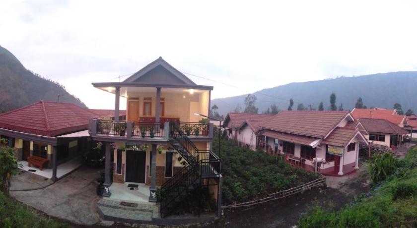 a large building with a clock on the side of it, Homestay Anggun Bromo in Bromo