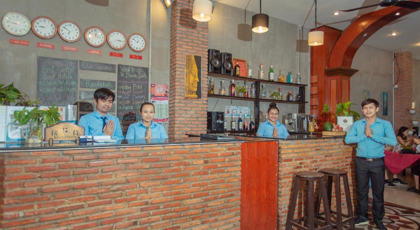 two young children are sitting at a counter in a restaurant, Best Central Point Hotel in Phnom Penh
