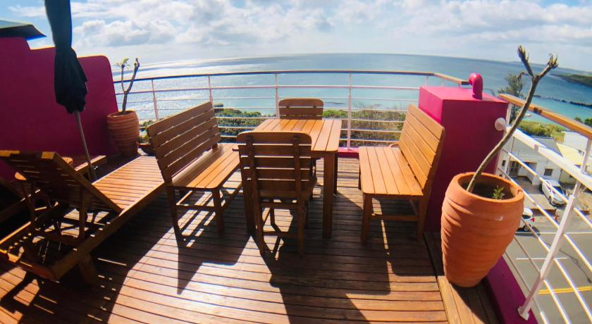 a wooden boat sitting on top of a wooden dock, Pin Ciao Hostel in Kenting