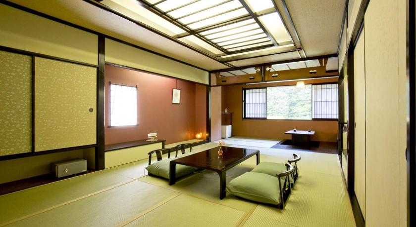 a room with a table, chairs and a window, Takamiya Ryokan Beni in Okura