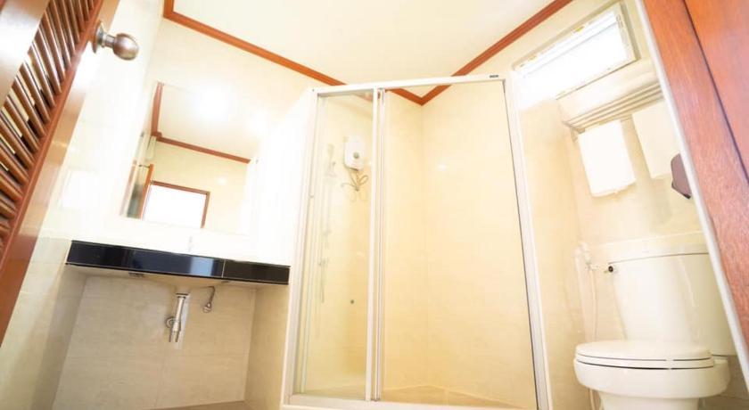 a bathroom with a toilet, sink, and shower, Baan Anong Hotel in Sa Kaeo