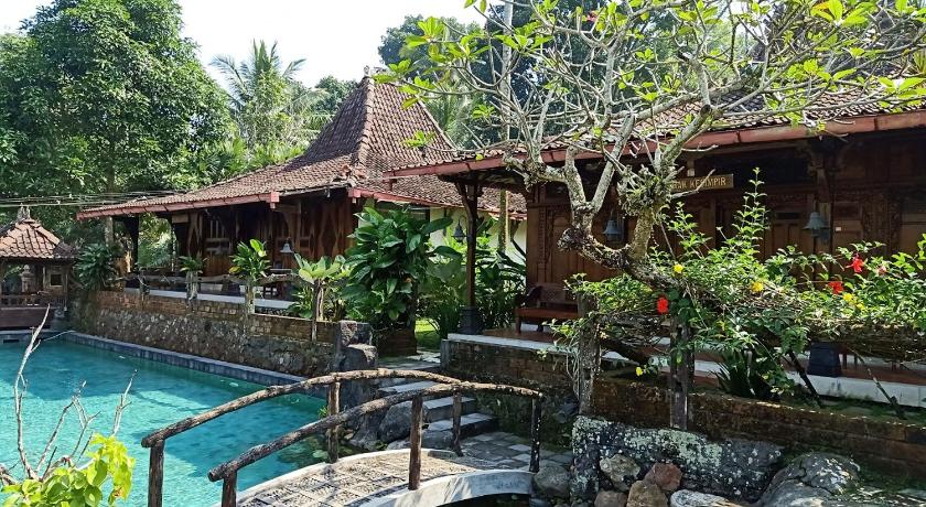 a patio with a pool and a pool table, Joglo Plawang Villa & Resort in Yogyakarta
