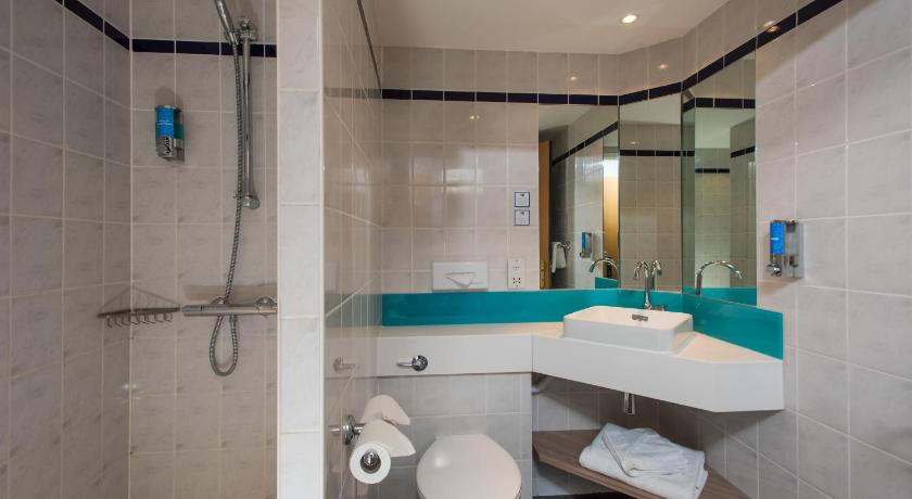 a bathroom with a toilet, sink, and shower, Holiday Inn Express London - Dartford in London