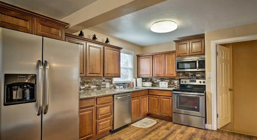 a kitchen with a stove, refrigerator, sink and cabinets, Pueblo House by Riverwalk, 2 Miles to Fairgrounds! in Pueblo (CO)