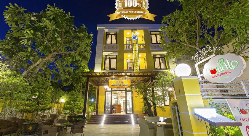 a large building with a clock on the front of it, Hai Au Boutique Hotel and Spa in Hoi An