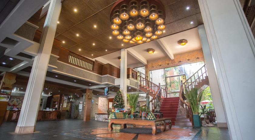 a large building with a clock on the ceiling, 100 Islands Resort and Spa in Surat Thani