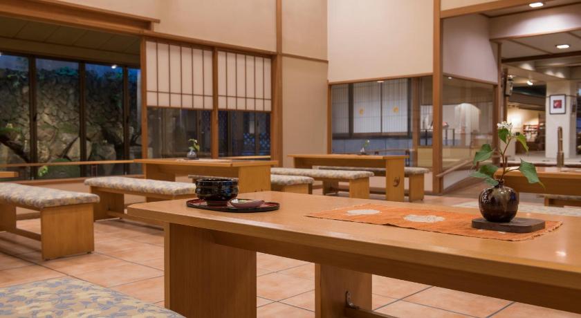 a living room filled with lots of furniture, Echigoyuzawa Onsen Shosenkaku Kagetsu Ryokan in Yuzawa
