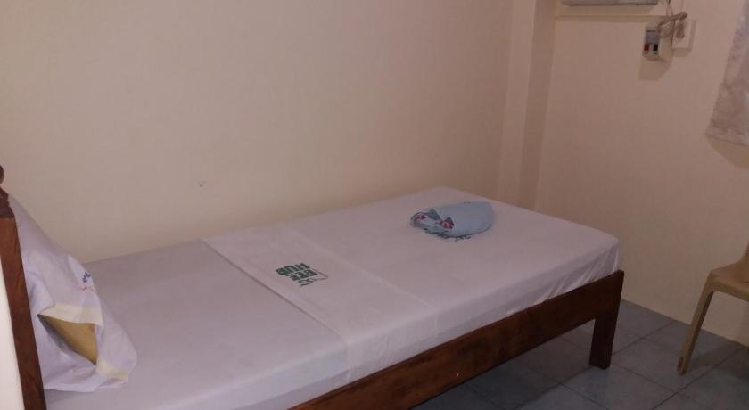 a small bed in a small room, Eco Pension in Surigao City