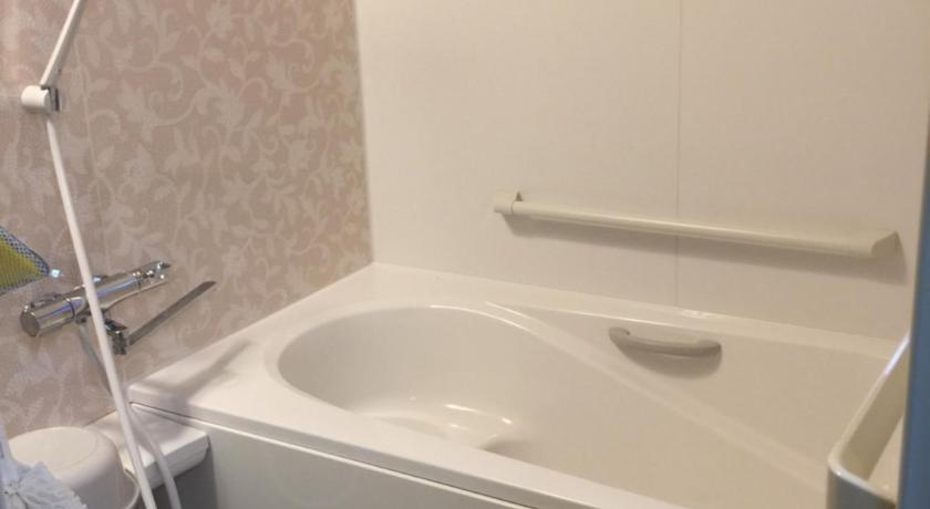 a bathroom with a sink and a bath tub, hanare in Shingu