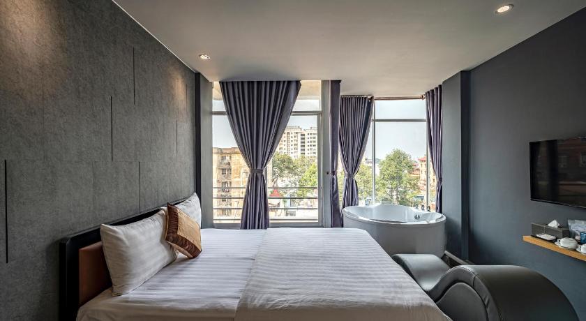 a bedroom with a bed and a window, Bonita Boutique Hotel in Ho Chi Minh City