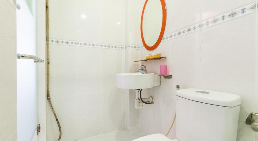 a white toilet sitting next to a white sink, OYO 701 Avatar 6 Hotel in Ho Chi Minh City