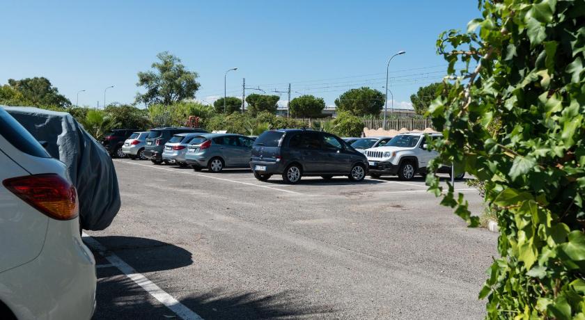 cars parked on the side of a road, Hotel Haiti in San Benedetto del Tronto