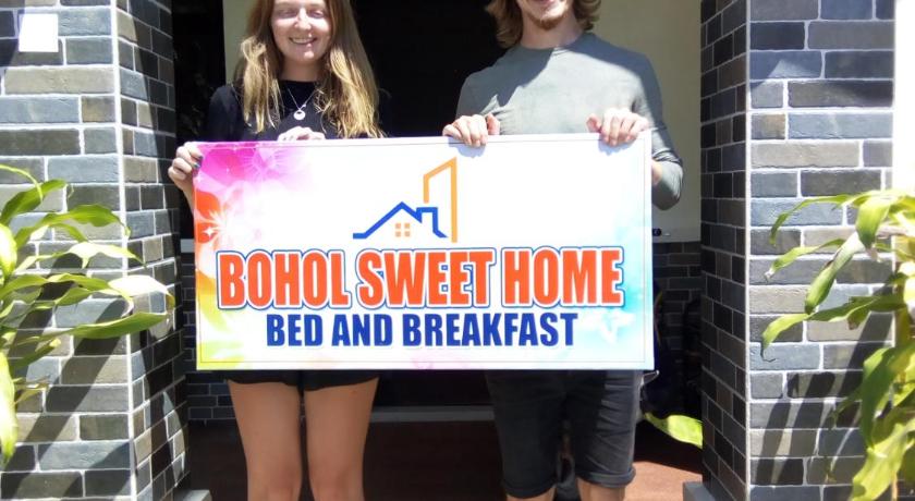 a woman and a man posing for a picture, BOHOL SWEET HOME BED AND BREAKFAST in Bohol
