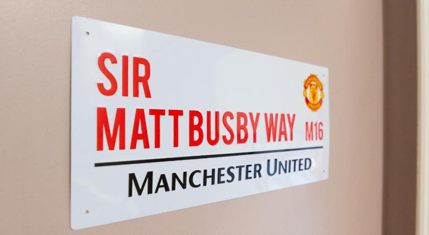 a sign on a white wall, Old Trafford Stadium Hotel in Manchester