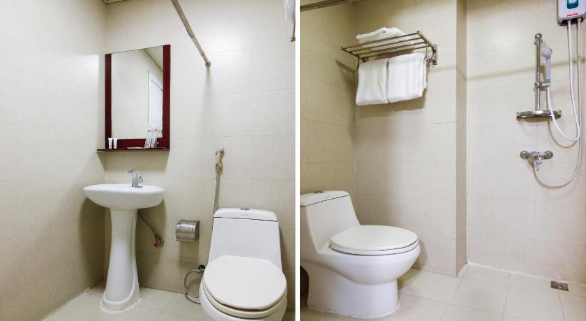 a bathroom with a toilet a sink and a shower, OYO 416 Lucky Hotel in Manila