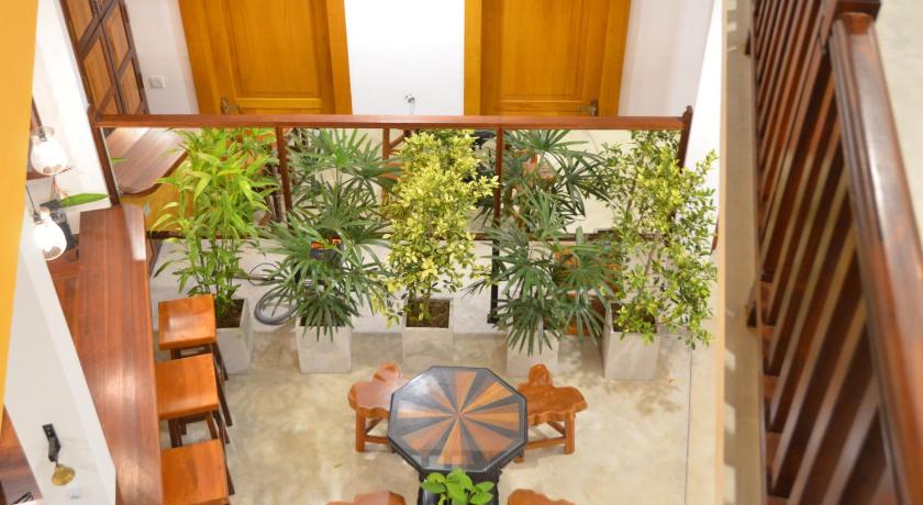 a patio area with a patio table and chairs, House On The Bend in Tangalle
