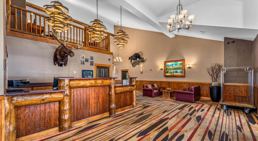 a living room filled with furniture and a large window, The Estes Park Resort in Estes Park (CO)